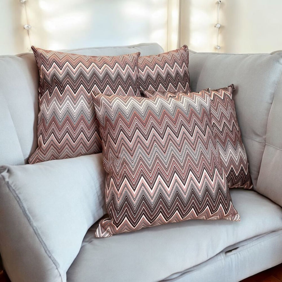 Coussin à motif zigzag aux tons prune